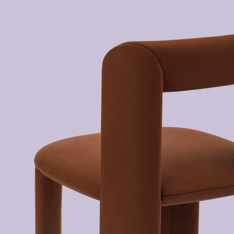 Distinctive Miniforms Amia chair crafted in reddish-brown textured fabric with a geometric form and crossed legs
