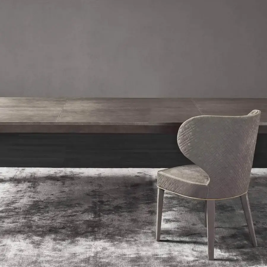 Superior Rugiano Forest table with muted gray-brown marble top and skillfully welded reflective chrome cylindrical legs