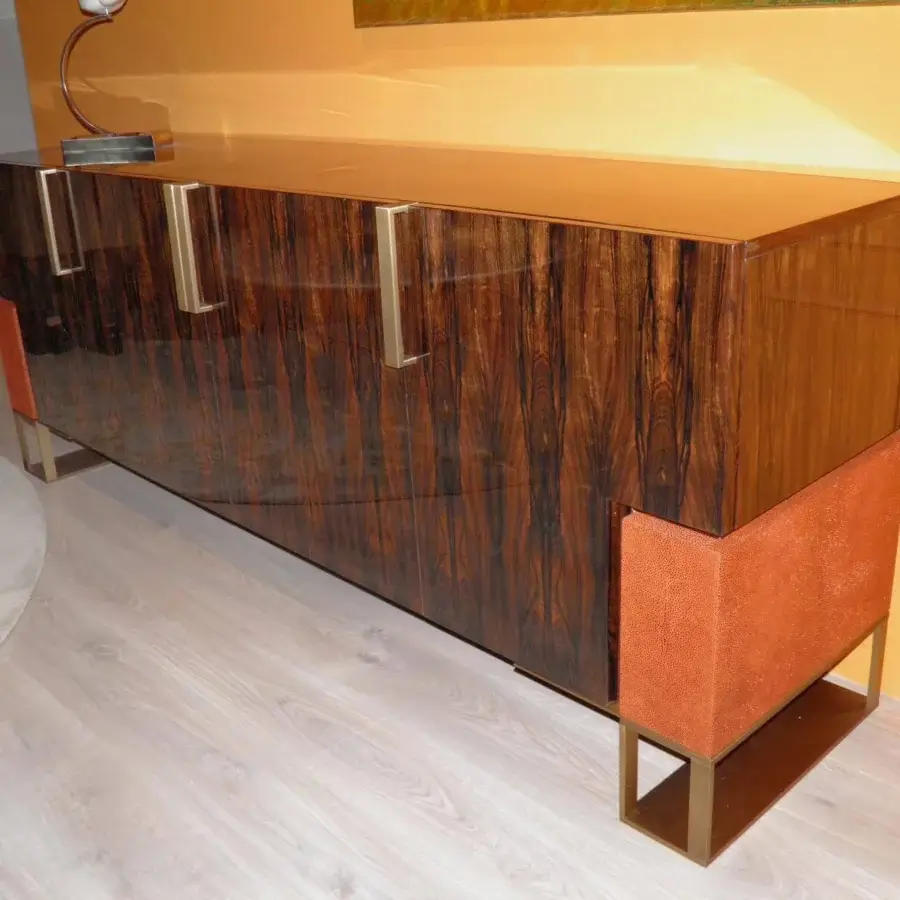 Distinguished OAK Montenapoleone sideboard crafted in polished ebony with orange textured accents and vertically aligned metal handles