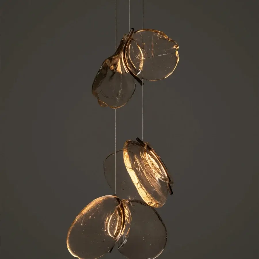 Captivating Bocci 141 Random suspension lamp with hand-blown glass pendants and nearly invisible coaxial cable system offering a warm amber glow