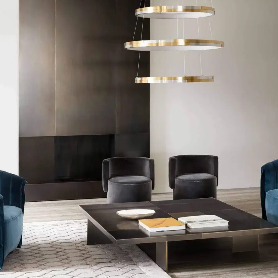 Sophisticated Rugiano Manta lounge chair upholstered in dark blue textile with vertical channel tufting and curved backrest