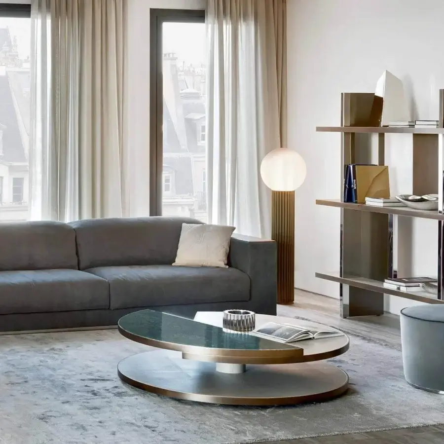 Elegant Rugiano Vogue sofa upholstered in muted grey textile with smooth finish and sleek metal base