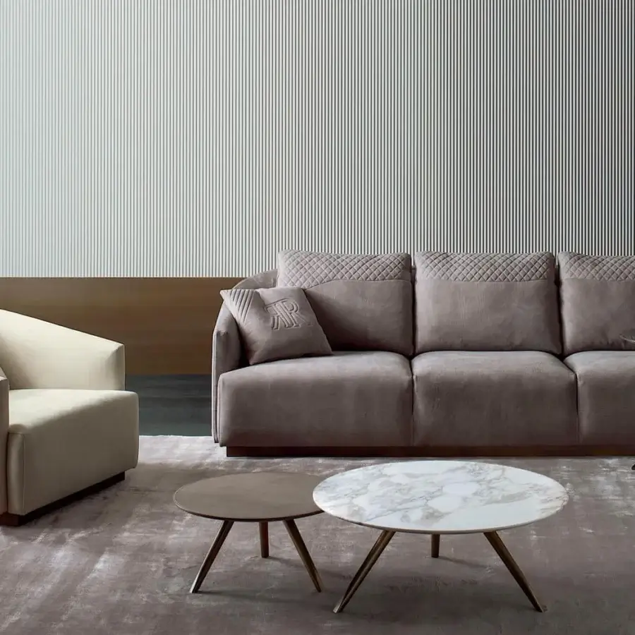 Distinguished Rugiano Opera sofa upholstered in muted taupe textile with matte finish and steel metal base