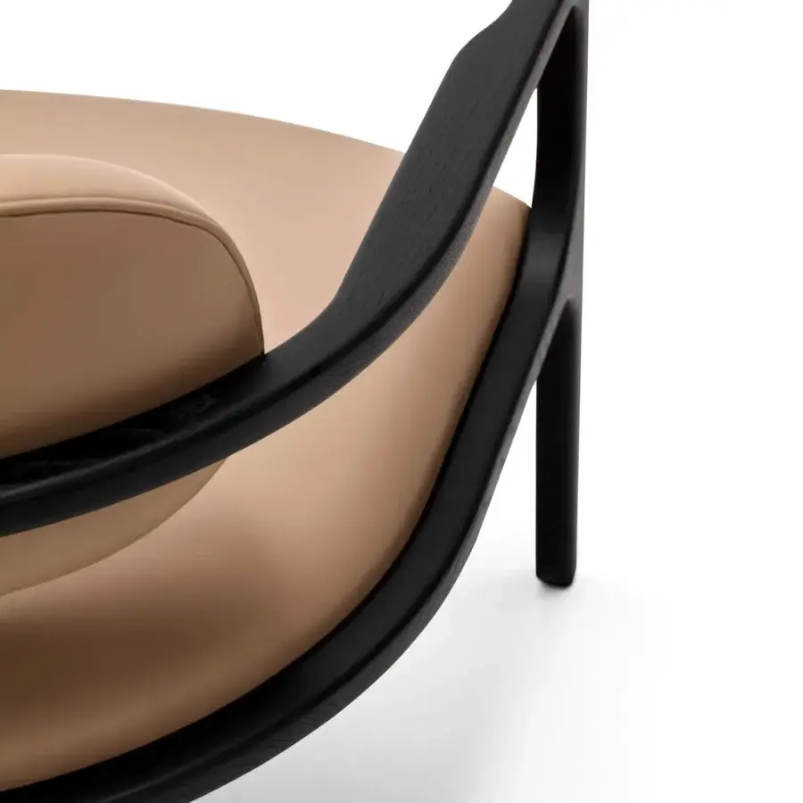 Exceptional Arketipo Brasilia lounge chair crafted in light tan synthetic upholstery with a black ash wood frame