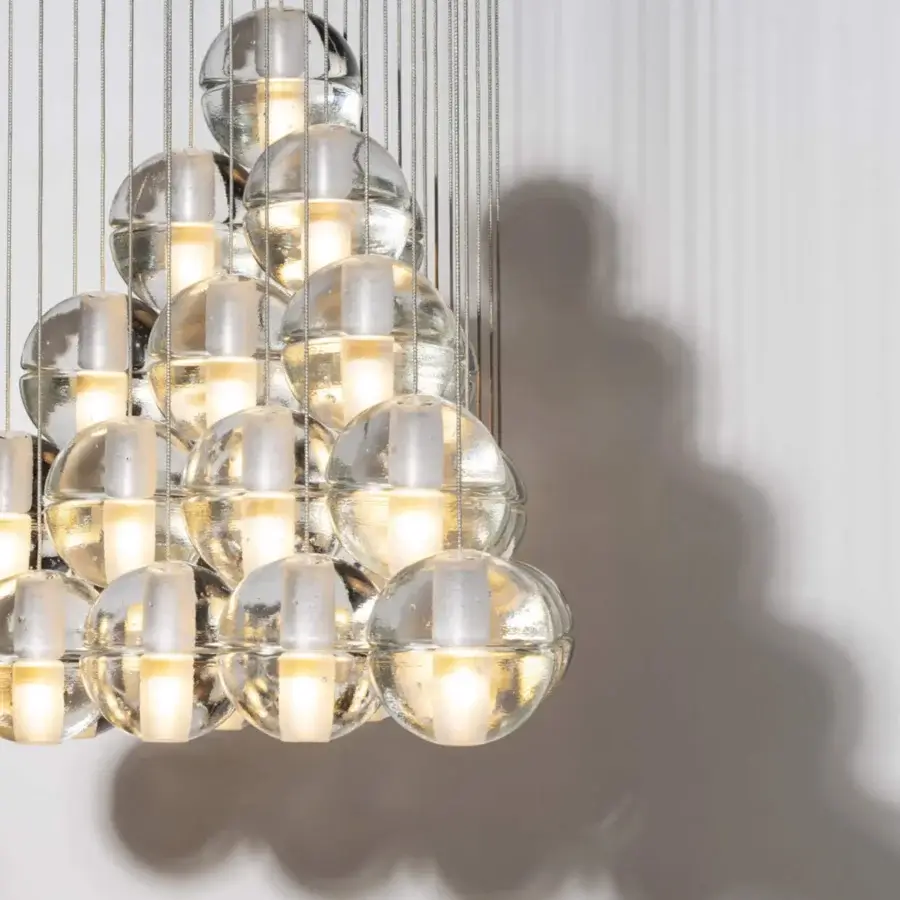 Exceptional Bocci 14 Geometric suspension lamp with hand-blown glass spheres and polished metallic accents creating a warm glow