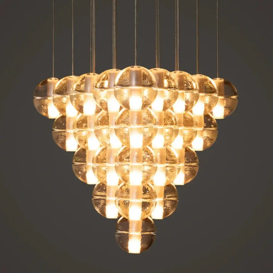 Elegant Bocci 14 Geometric suspension lamp with clustered glass spheres and textured matte finish emitting golden light