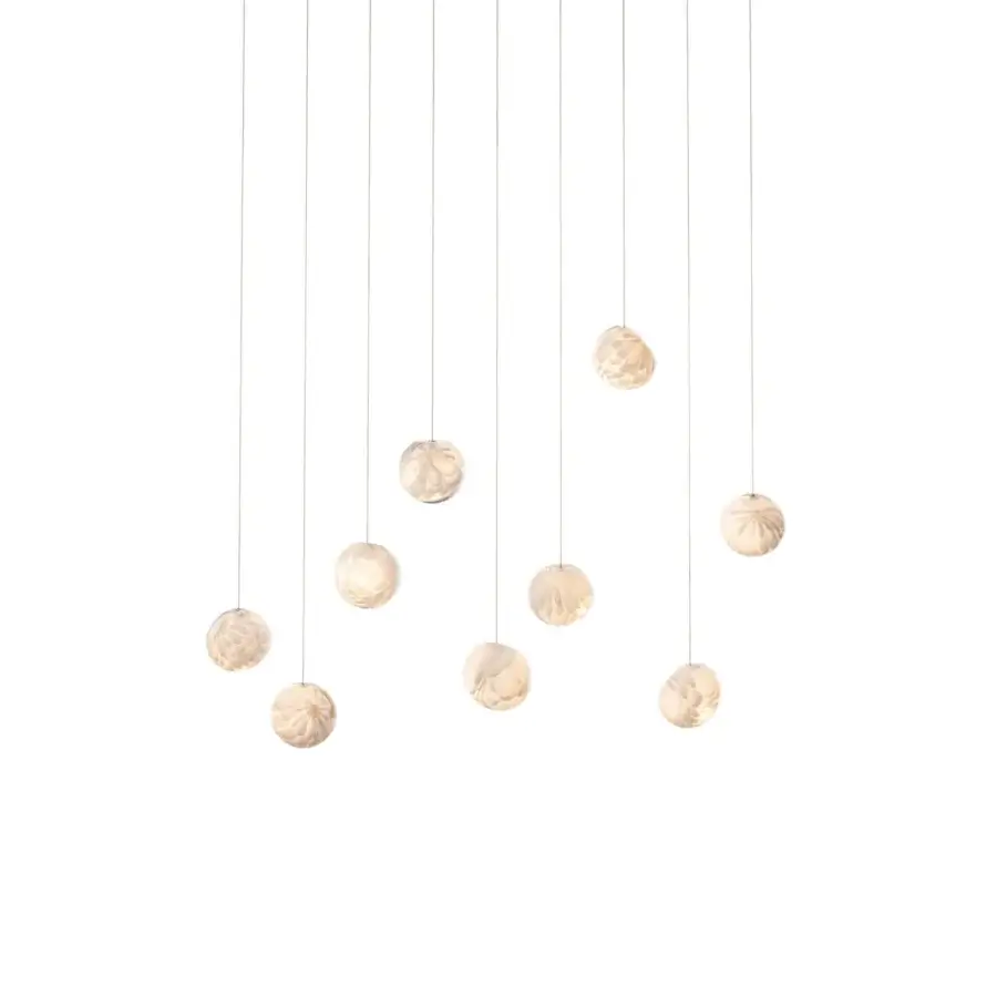 Exceptional Bocci 118 Linear Suspension Lamp with nine hand-blown glass pendants exhibiting a warm pale gold tone and translucent texture