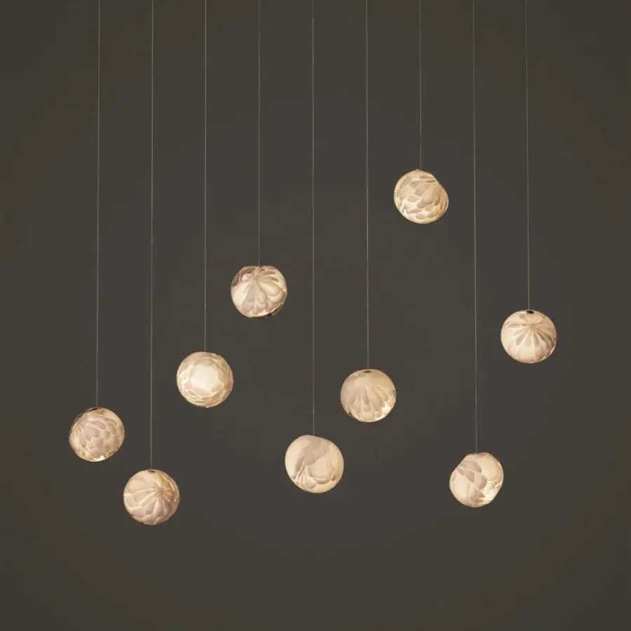 Lavish Bocci 118 Linear Suspension Lamp with nine hand-blown glass pendants exhibiting a satin finish and floral texture