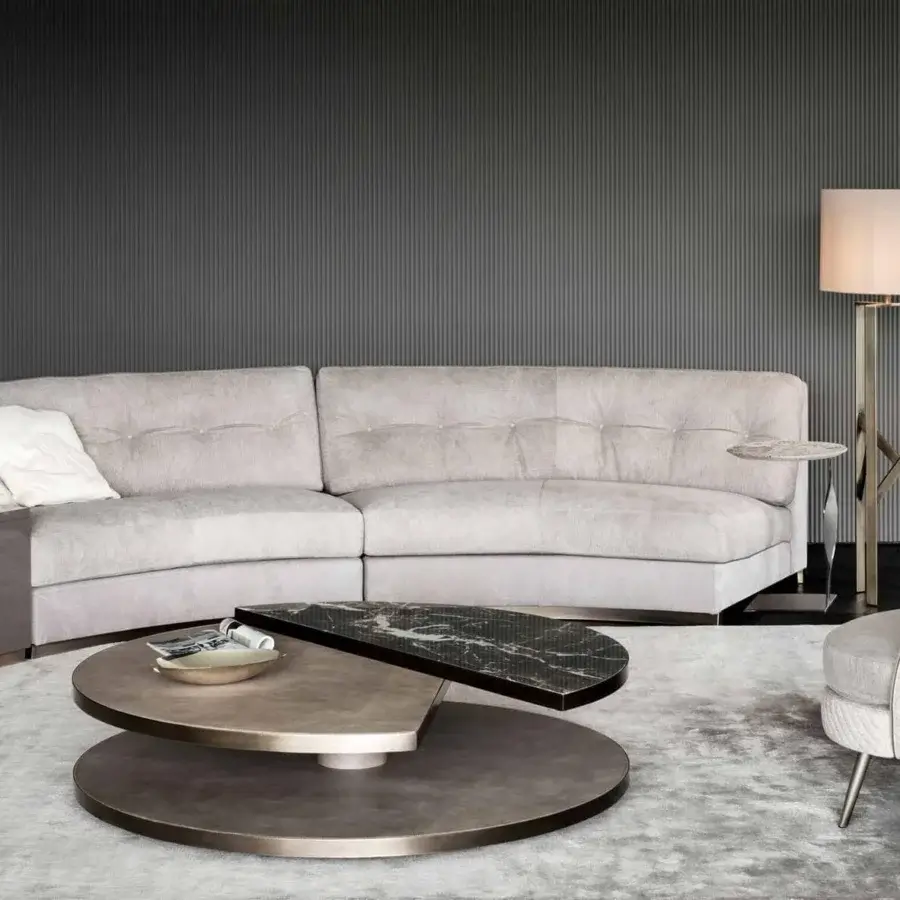 Sophisticated Rugiano Moon coffee table with curved lines, a leather base and dark marble-like surface in bronze finish