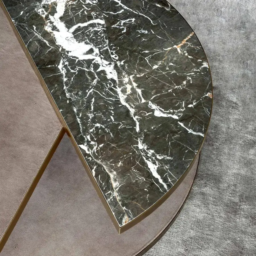 Lavish Rugiano Moon coffee table with dark marble and white veining, built with a tan leather lower tier and bronze finish
