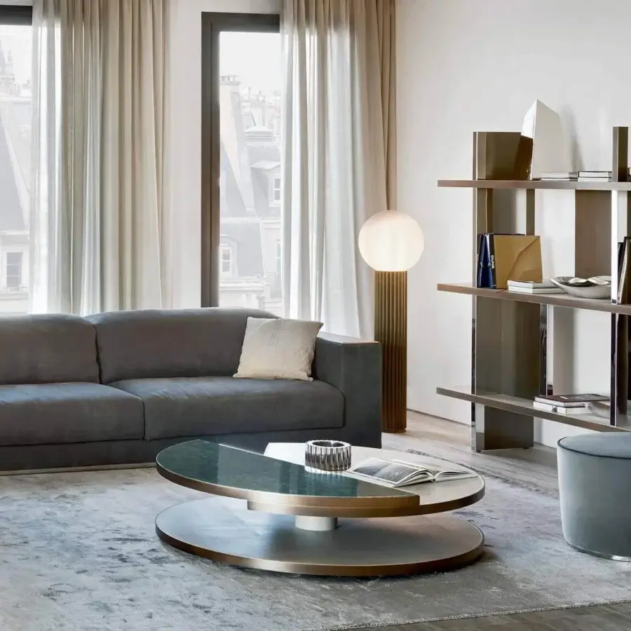 Exceptional Rugiano Moon coffee table with bi-color top in leather and ebony wood, encircled by bronze-finished metal detail