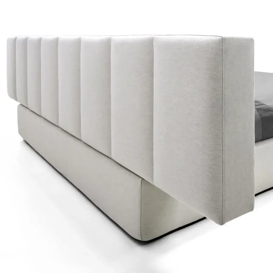 Superior Arketipo Milky Way Dream bed with vertically channeled panels and matte neutral gray textile upholstery