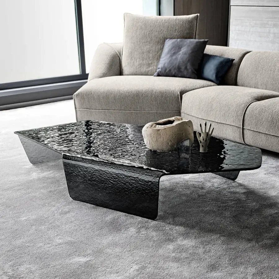Distinguished Arketipo Chimera coffee table crafted in deep black curved and hammered glass with a rippled reflective finish