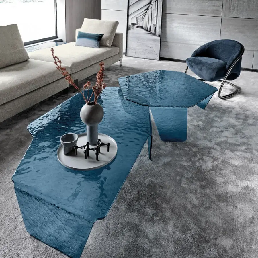 Luxury Arketipo Chimera coffee table with curved hammered glass in deep teal blue and a highly glossy finish