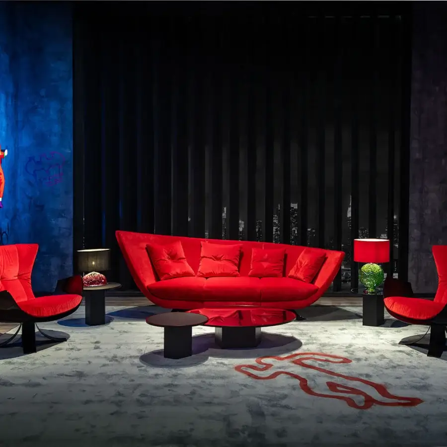 Distinctive Joker Home Throne lounge chair with hand-sculpted fiberglass shell enveloped in rich red velvet with unpredictable textures