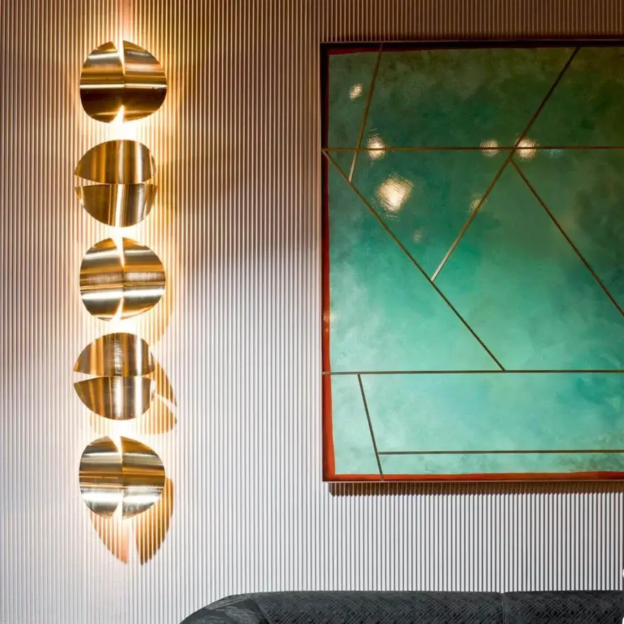 Exclusive Rugiano Duo wall lamp crafted in golden brass metal with a glossy finish and circular elements