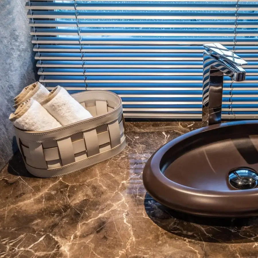 Refined Pinetti Demetra towel baskets crafted in Italy with dark gray woven regenerated leather and lighter gray straps