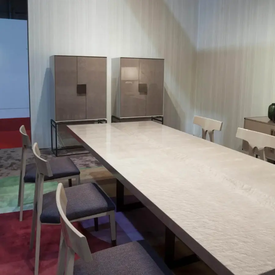Superior Costantini Pietro Blade table with textured light beige stone-like top and dark metal base
