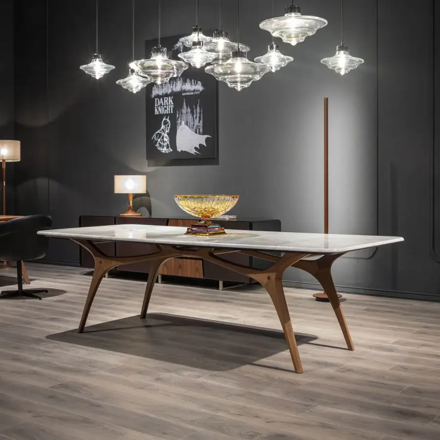 Distinguished WAYNE Enterprises WE-020 table with light marble tabletop and satin finished solid wood base exhibiting gently curved lines