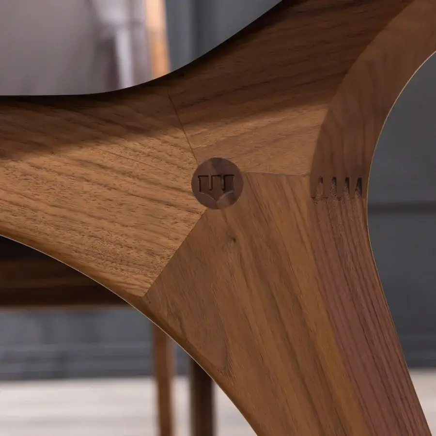 Elegant WAYNE Enterprises WE-020 table with organically curved form in medium-brown wood and satin finish