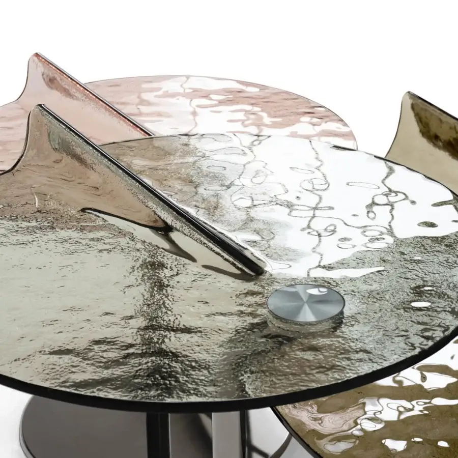 Superior Arketipo Maverick coffee table with mottled glass in gray, bronze and rose gold rising from a dark cylindrical base and polished metallic structure