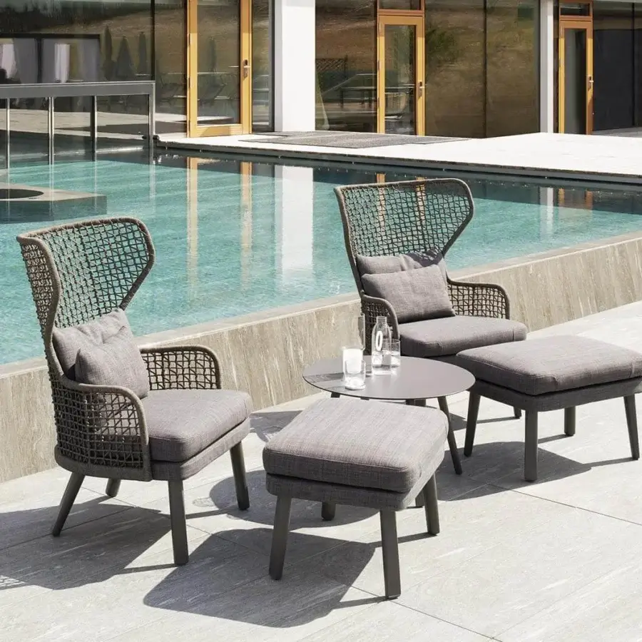 Exclusive Varaschin Emma Bergere lounge chair with muted gray textile cushions and sleek aluminum legs crafted in woven synthetic rope