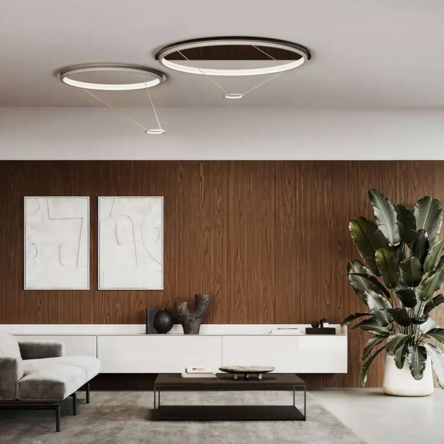 Elegant Italamp Loop ceiling lamp built in metal with a polished finish emitting warm light