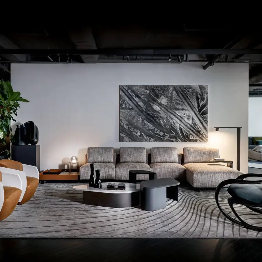 Superior Giorgetti Lorelei lounge chair with dark gray lacquered shells and refined leather inserts crafted in Italy