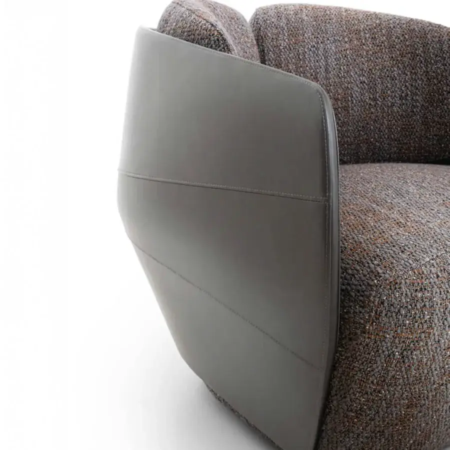 Exceptional Giorgetti Lorelei lounge chair crafted with earthy textile upholstery and smooth matte gray leather accents