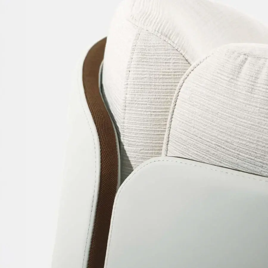 Elegant Giorgetti Lorelei lounge chair with lacquered shell and comfortable leather inserts in off-white hues with glossy finish