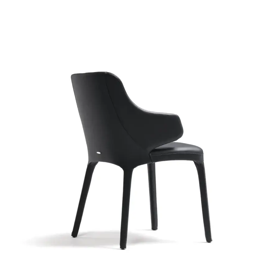 Distinguished Cattelan Italia Wanda armchair with black synthetic leather and curved backrest presenting a uniform matte finish