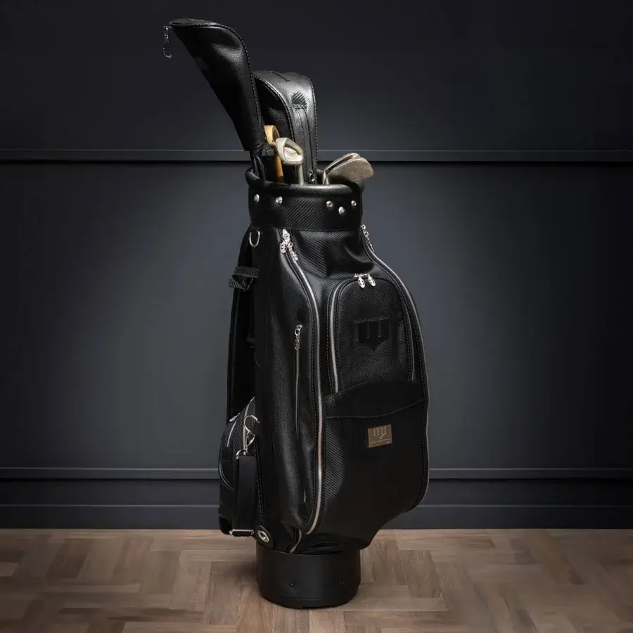 Distinctive WAYNE Enterprises WE-GOLF 048 golf bag with black leather and textured carbon fiber leather, accented by striking silver hardware