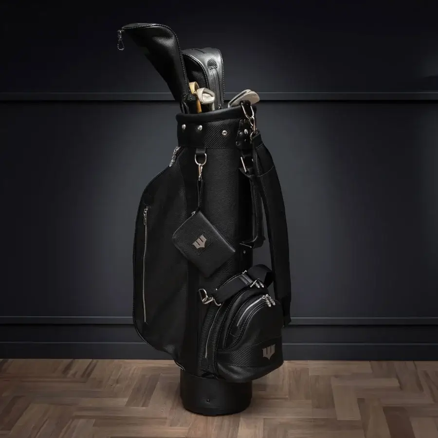Exclusive WAYNE Enterprises WE-GOLF 048 golf bag in sleek black leather and textured carbon fiber leather with nickel logo and Batman zip handle