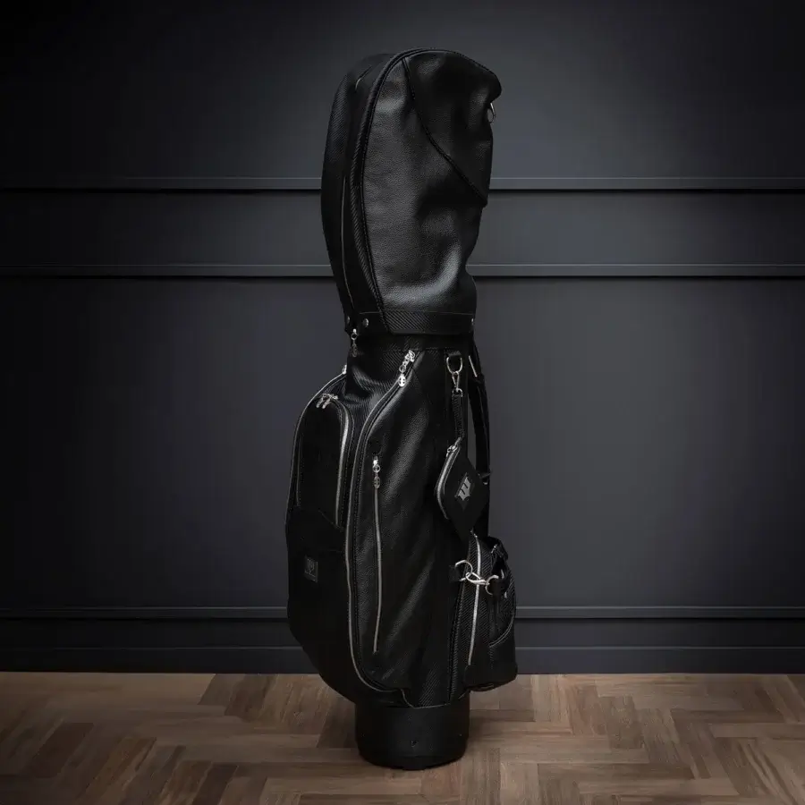 Elegant WAYNE Enterprises WE-GOLF 048 golf bag crafted in black leather and textured carbon fiber leather with silver metal accents