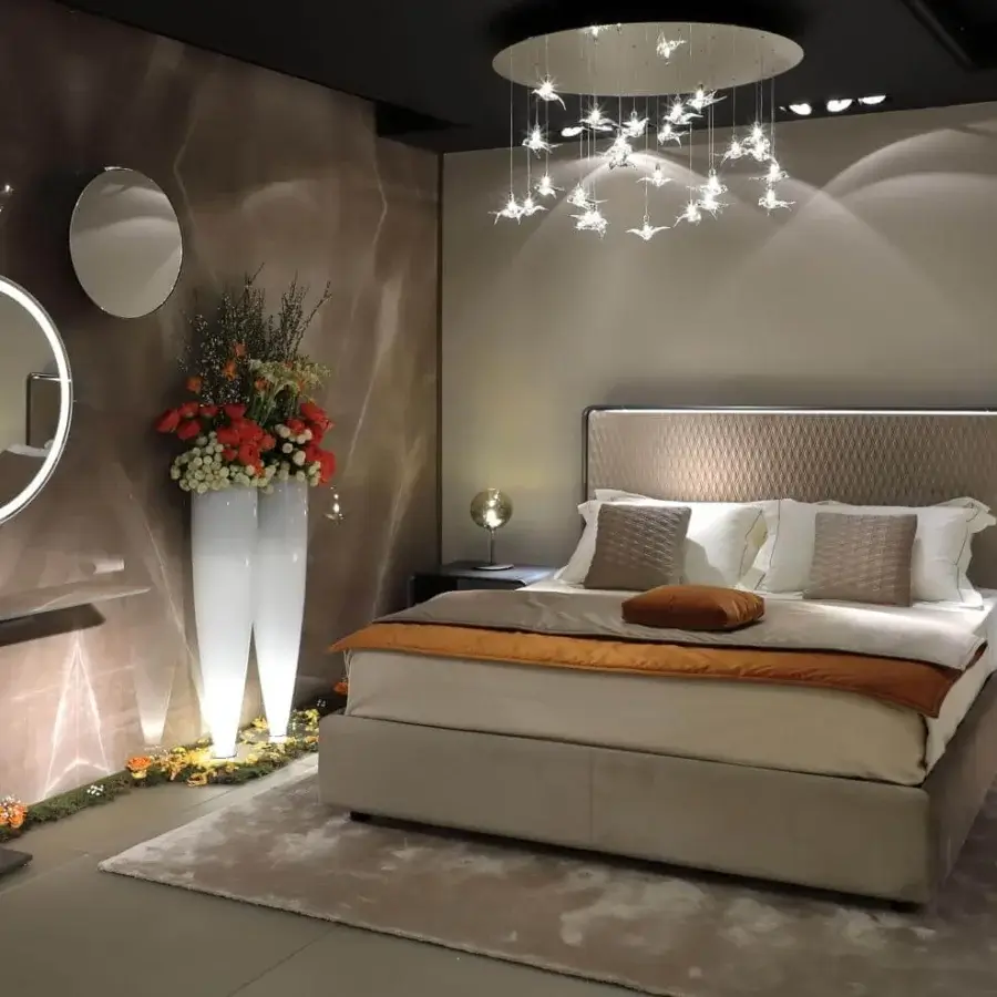 Exceptional Reflex Oh bed with padded beige textile and diamond quilting, built with a bronze shaped wooden frame and integrated lighting