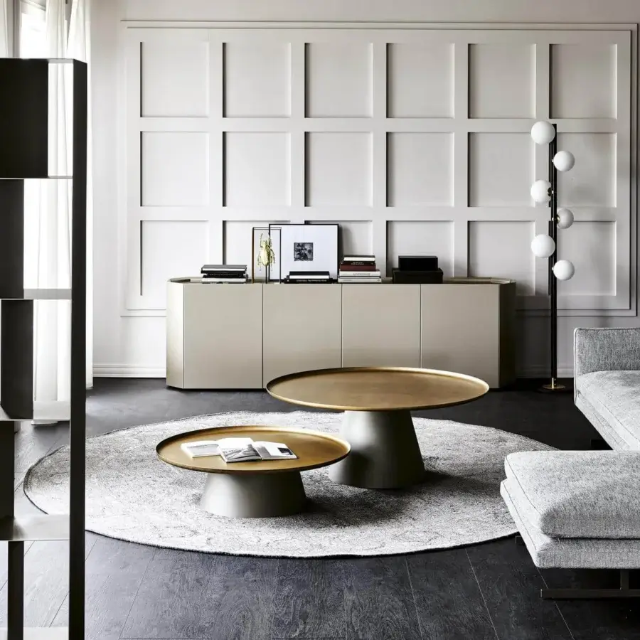 Distinguished Cattelan Italia Amerigo coffee table with a round golden tabletop in brushed brass lacquered steel and titanium embossed base
