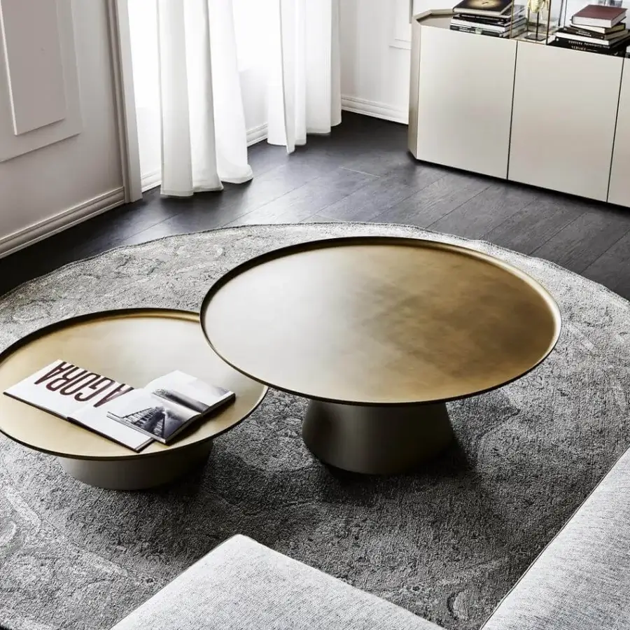 Distinguished Cattelan Italia Amerigo coffee table with a round top in brushed brass lacquered steel and titanium embossed lacquered steel base