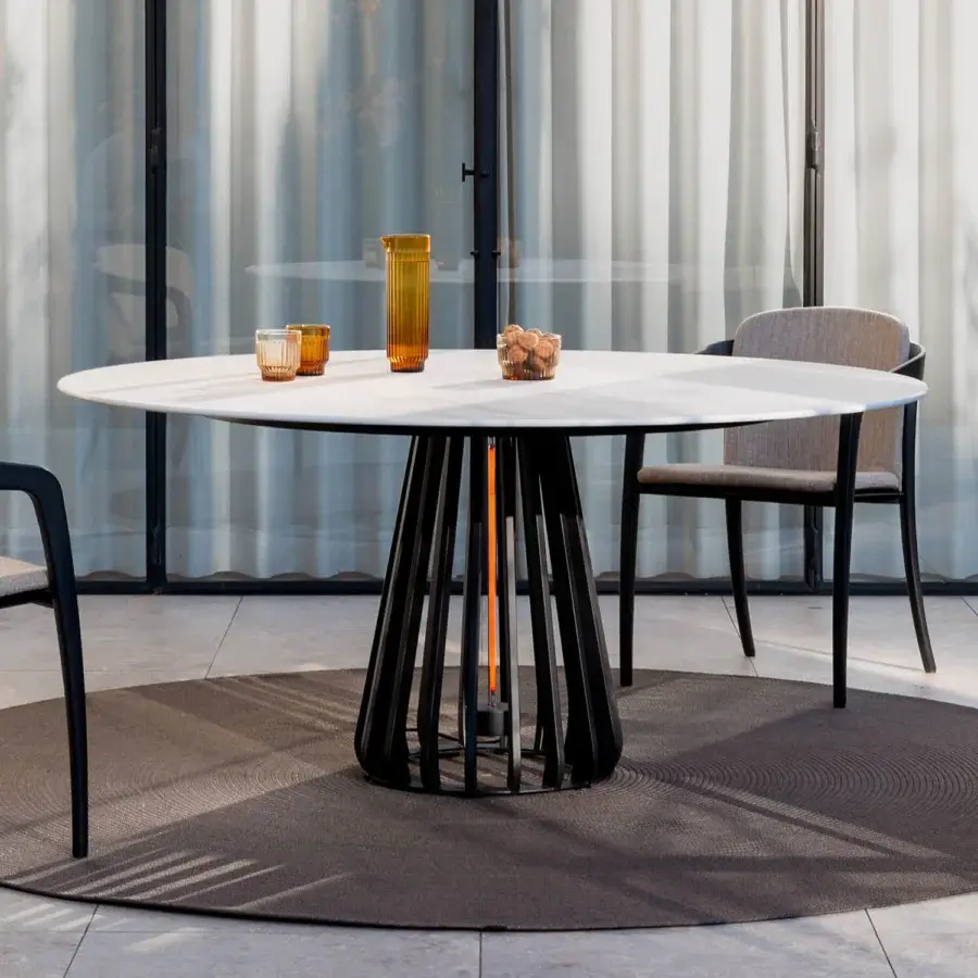Distinguished Royal Botania Furniz table with a matte white tabletop and sculptural black metal base crafted for outdoor use