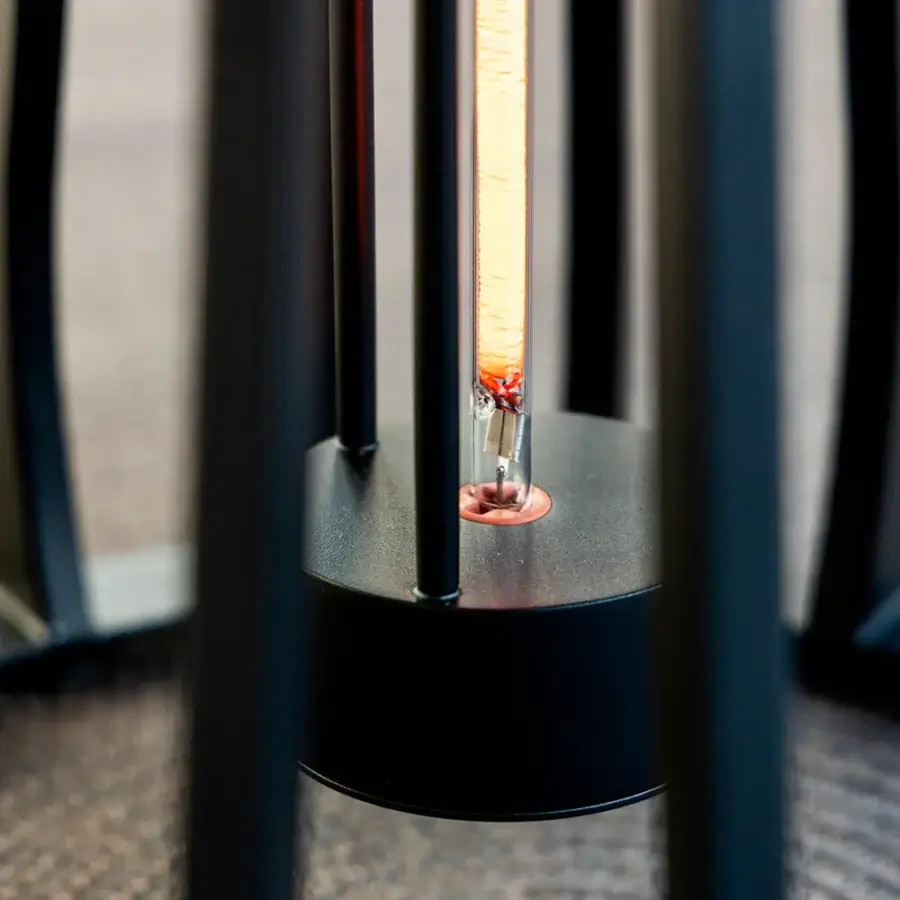 Exceptional Royal Botania Furniz table with a cage-like structure built in dark-toned metal and matte finish illuminated by a vintage Edison bulb