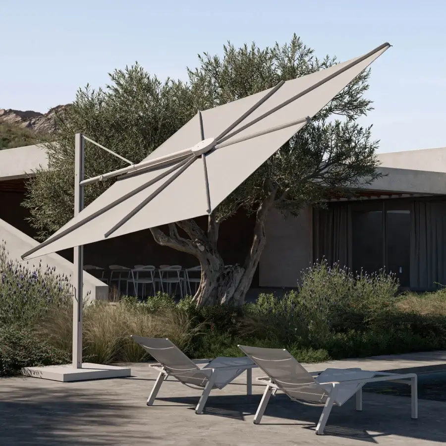 Innovative Royal Botania Solaz umbrella with a light beige textile canopy and sleek matte metal frame