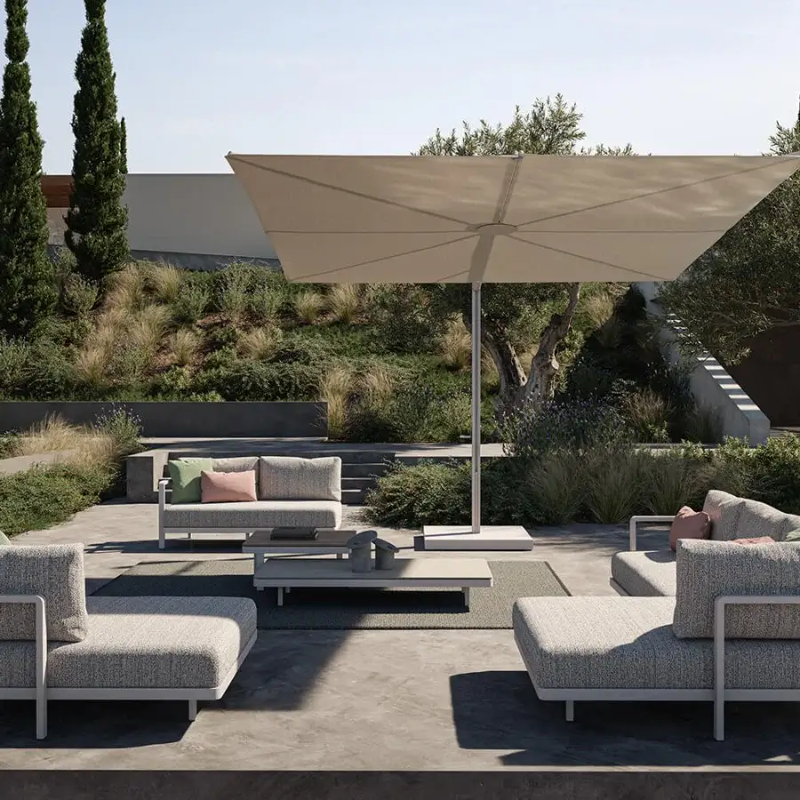 Distinguished Royal Botania Solaz umbrella with a light beige textile canopy and smooth silver metal frame built for full tilt and rotation
