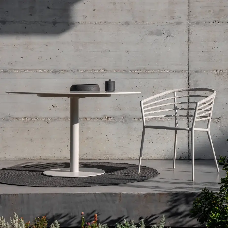 Sophisticated Royal Botania Archy armchair crafted with textured pale synthetic material and integrated sleeves wrapping a tubular backrest
