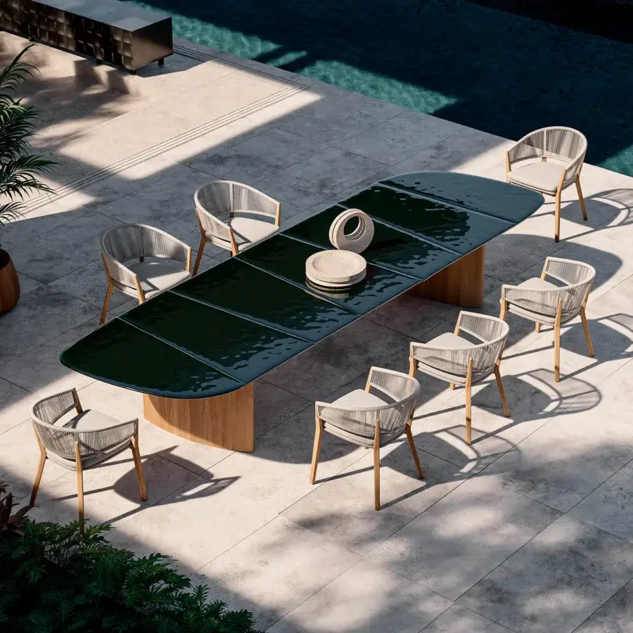 Exceptional Royal Botania Regaliz table with dark green glass crafted using a melting technique and gracefully curved teak bases
