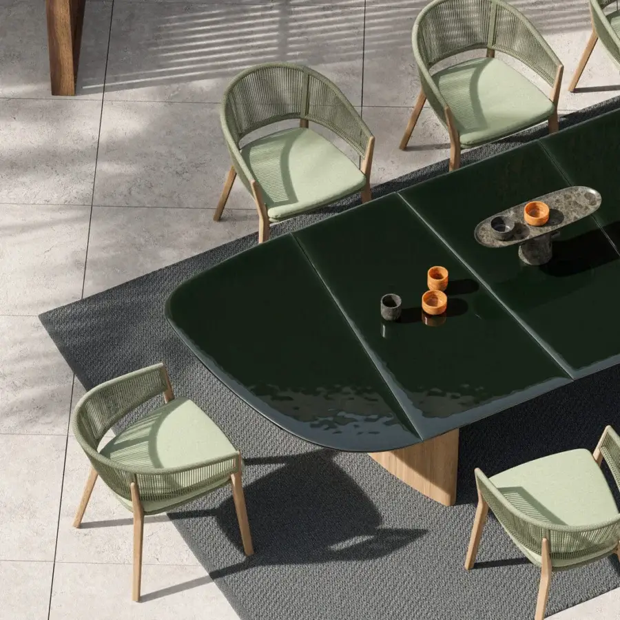 Exceptional Royal Botania Regaliz table with a dark green glass top crafted using a unique melting technique and teak base