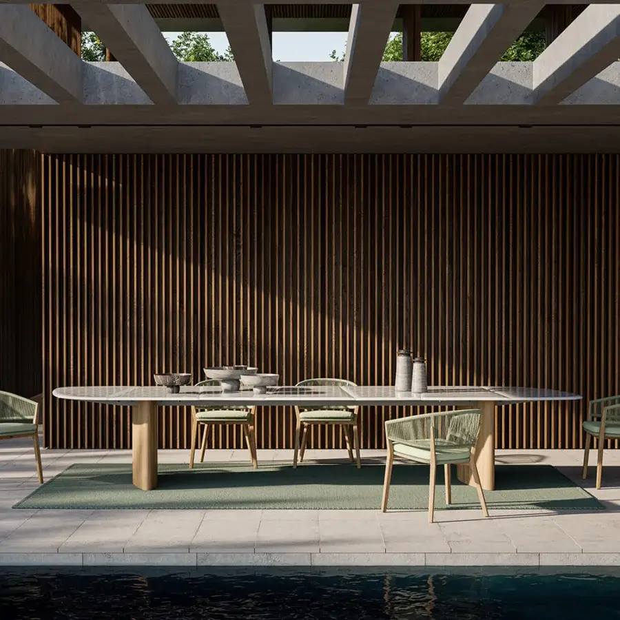 Elegant Royal Botania Regaliz table with light glass top and parallel teak bases finished in smooth satin wood