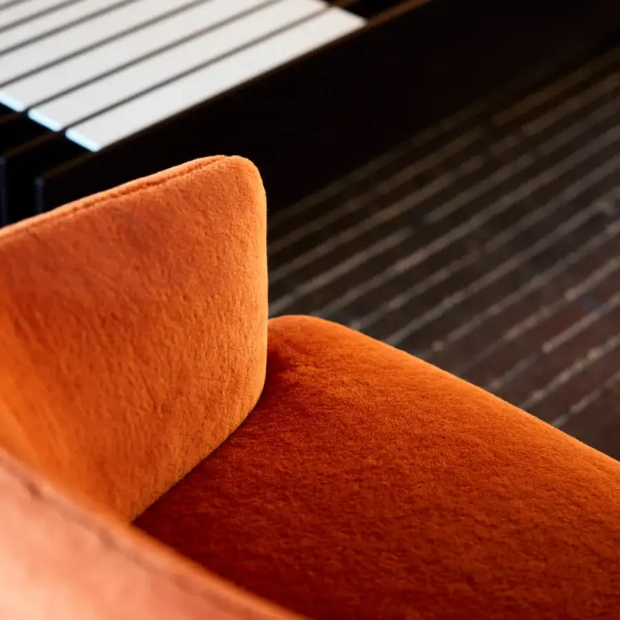 Distinguished Giorgetti Hero lounge chair in saturated orange fabric with two-tone leather and canaletto walnut base