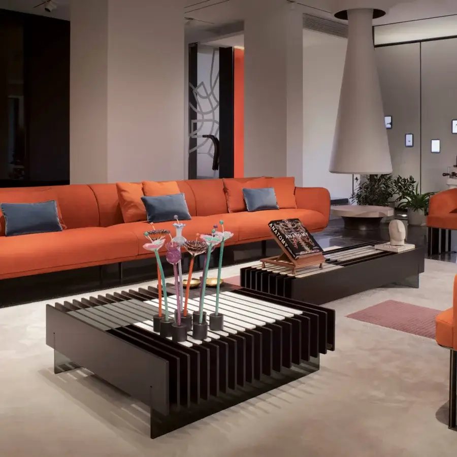 Superior Giorgetti Hero lounge chair in reddish-orange fabric with a canaletto walnut base and matte metal framework