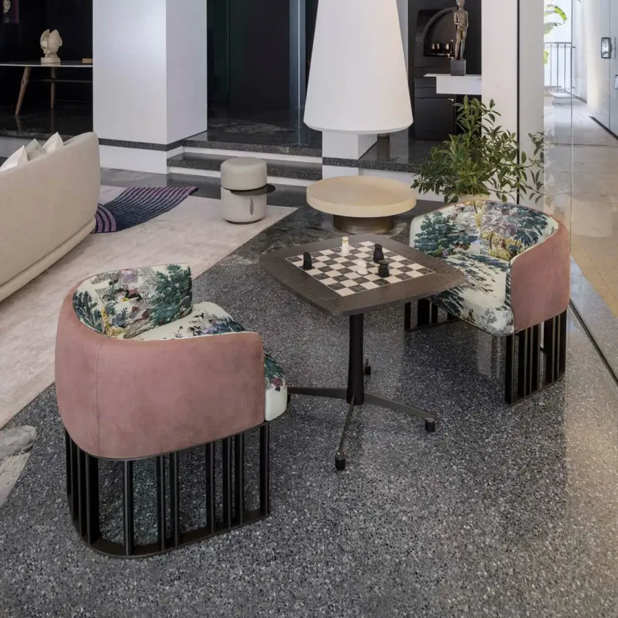 Exceptional Giorgetti Hero lounge chair crafted with rose pink fabric, canaletto walnut, and a metal cage-like structure with landscape textile accents