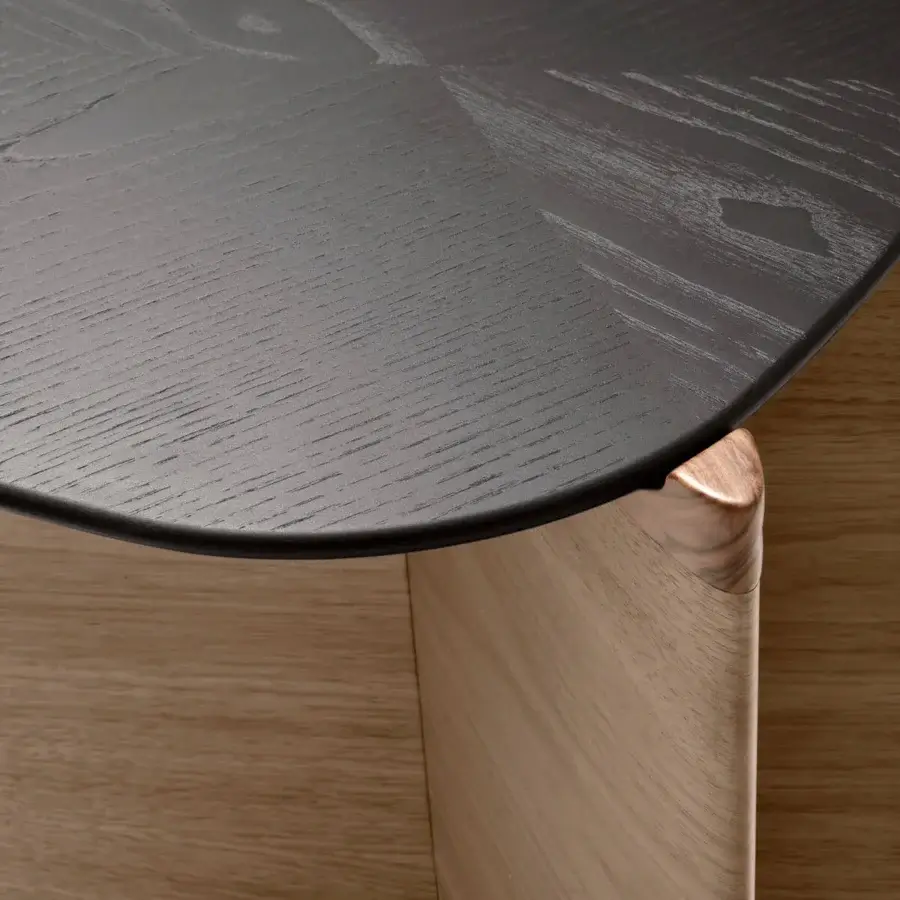Exceptional Giorgetti Griffe coffee table with an asymmetrical Canaletto walnut base and dark-toned wood tabletop crafted in visible grain with pau ferro accents