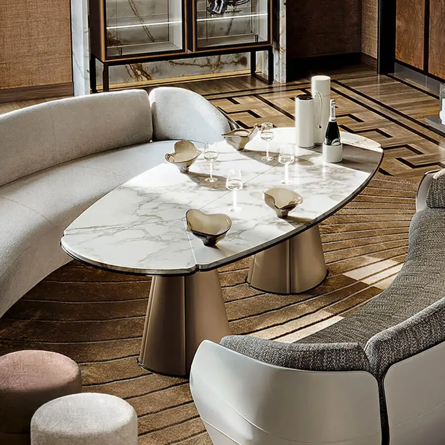 Distinguished Giorgetti Floria lounge table with sculpted form in grey veined marble and glossy finish crafted with leather legs